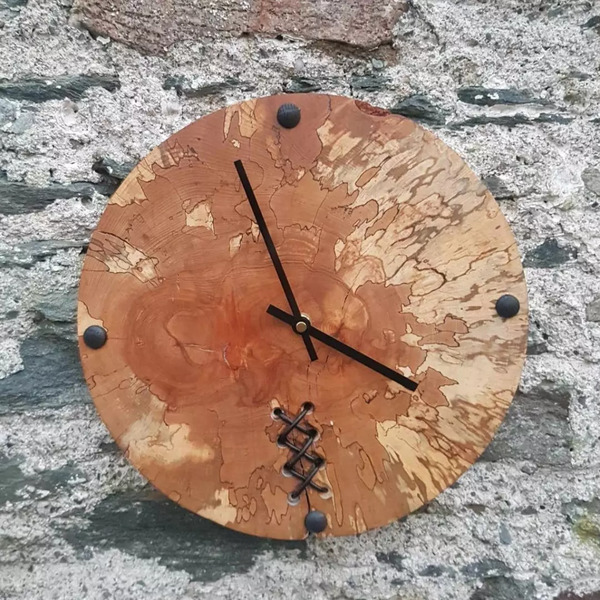 Spalted beech clock with leather detail.